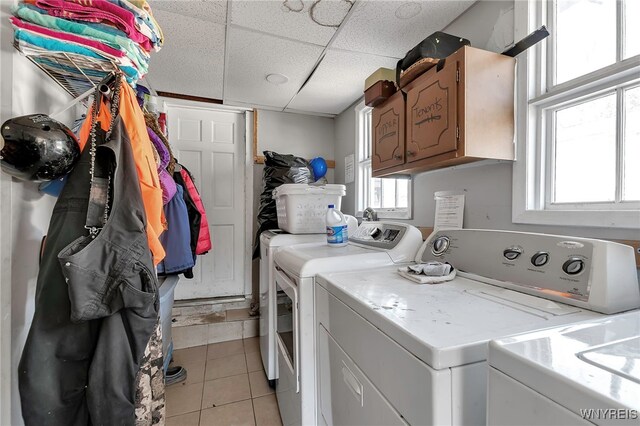 192 Pine St, Lockport City, NY 14094 - washroom with separate washer and dryer, light tile patterned floors, and cabinet space