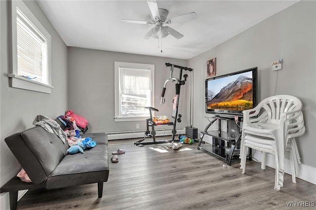 192 Pine St, Lockport City, NY 14094 - exercise room with baseboards, a ceiling fan, and wood finished floors