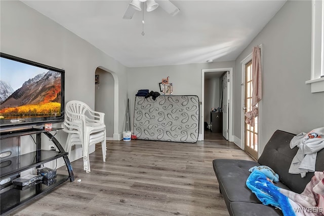 192 Pine St, Lockport City, NY 14094 - living area with ceiling fan, arched walkways, wood finished floors, and baseboards