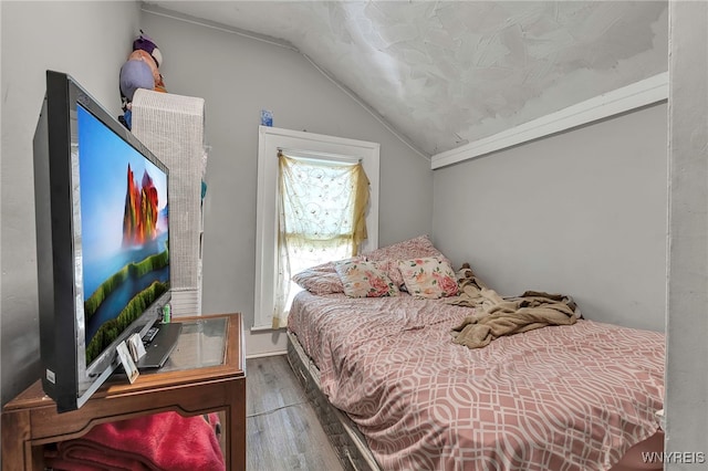 192 Pine St, Lockport City, NY 14094 - bedroom with vaulted ceiling and wood finished floors