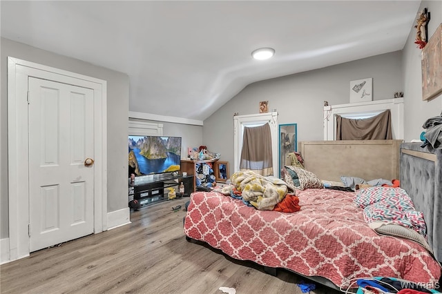 192 Pine St, Lockport City, NY 14094 - bedroom featuring vaulted ceiling and wood finished floors