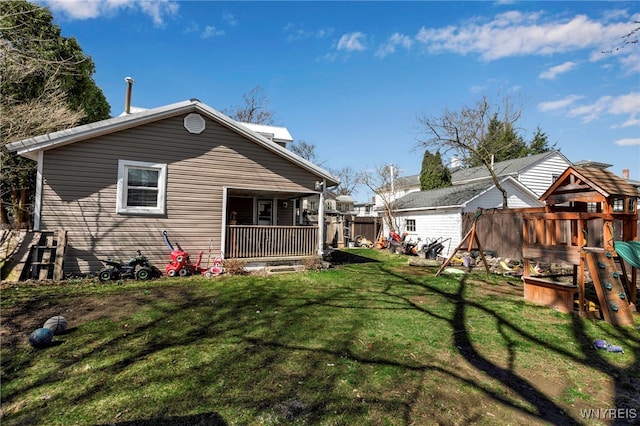 192 Pine St, Lockport City, NY 14094 - rear view of house featuring an outbuilding, a playground, a lawn, and a shed