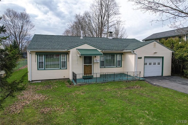 single story home featuring a garage, aphalt driveway, a chimney, and a front lawn