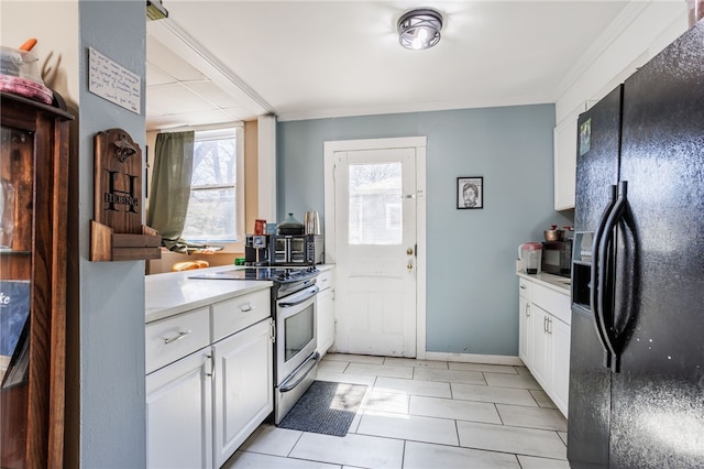kitchen with black refrigerator with ice dispenser, electric stove, light countertops, and white cabinetry