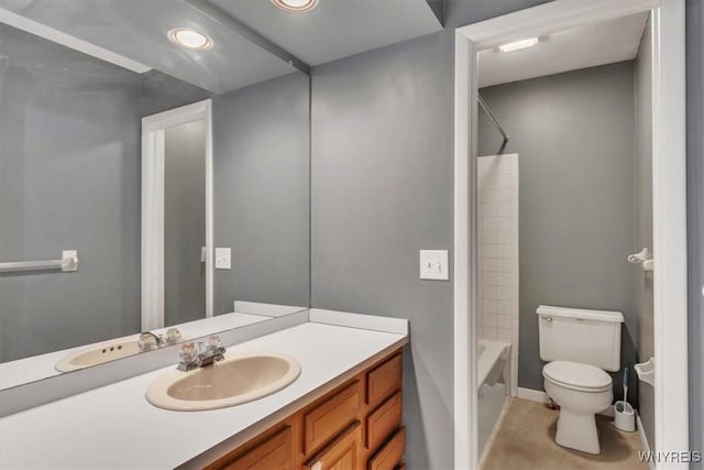 full bathroom featuring baseboards, toilet, recessed lighting, vanity, and bathing tub / shower combination