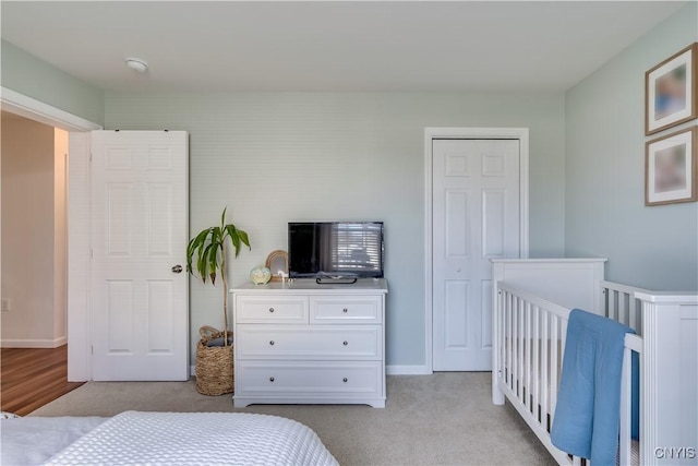 carpeted bedroom with baseboards