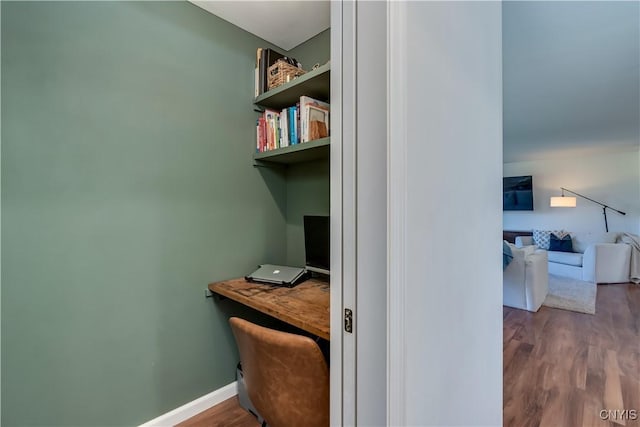 office area featuring wood finished floors and baseboards