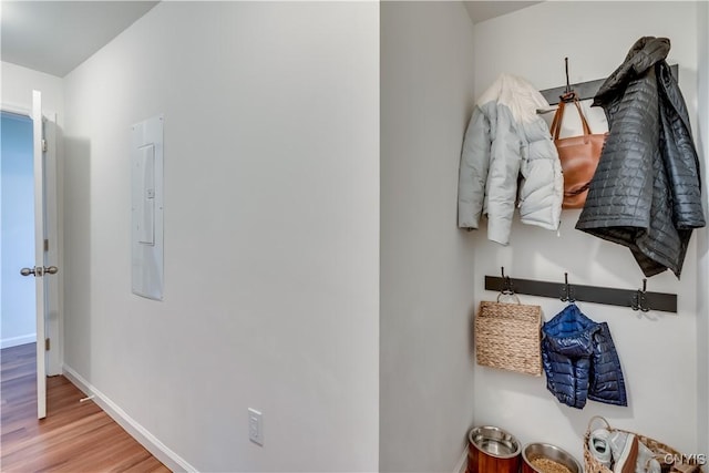 mudroom featuring baseboards and wood finished floors