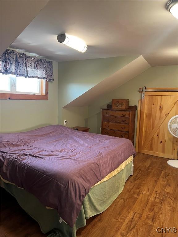 13832 County Route 91, Ellisburg, NY 13605 - bedroom with vaulted ceiling and wood finished floors