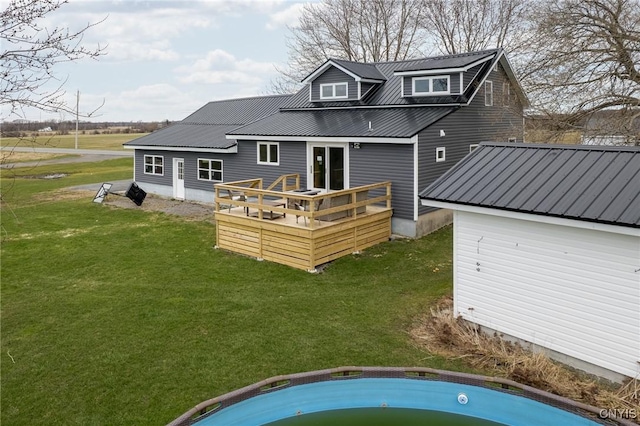13832 County Route 91, Ellisburg, NY 13605 - back of property featuring a jacuzzi, a wooden deck, metal roof, and a lawn