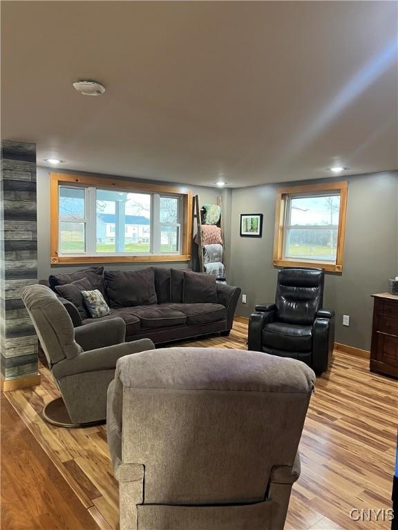 13832 County Route 91, Ellisburg, NY 13605 - living room featuring recessed lighting, light wood-style flooring, baseboards, and a healthy amount of sunlight