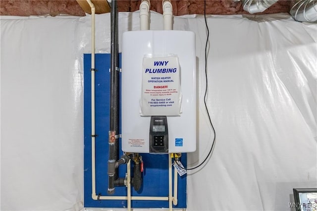 utility room featuring tankless water heater