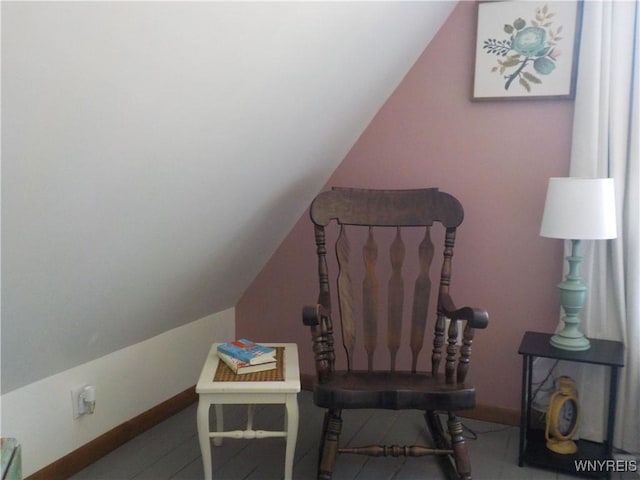office space with baseboards and lofted ceiling