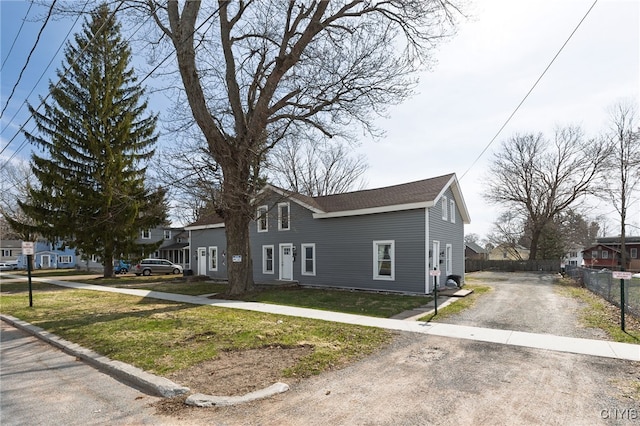 15-17A Vincent St, Champion, NY 13619 - view of front of house featuring driveway, a front yard, and fence