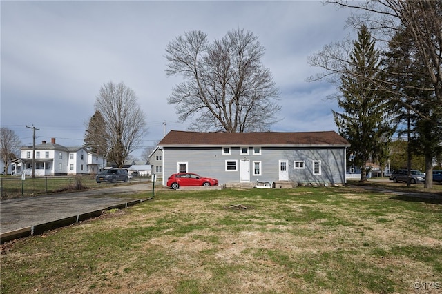 15-17A Vincent St, Champion, NY 13619 - back of property with a yard, entry steps, and fence