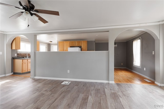 15-17A Vincent St, Champion, NY 13619 - unfurnished living room with visible vents, baseboards, light wood finished floors, and arched walkways