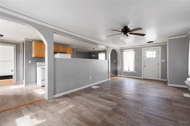 15-17A Vincent St, Champion, NY 13619 - interior space with baseboards, crown molding, ceiling fan, arched walkways, and wood finished floors