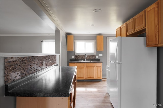 15-17A Vincent St, Champion, NY 13619 - kitchen featuring tasteful backsplash, recessed lighting, freestanding refrigerator, light wood-style floors, and a sink