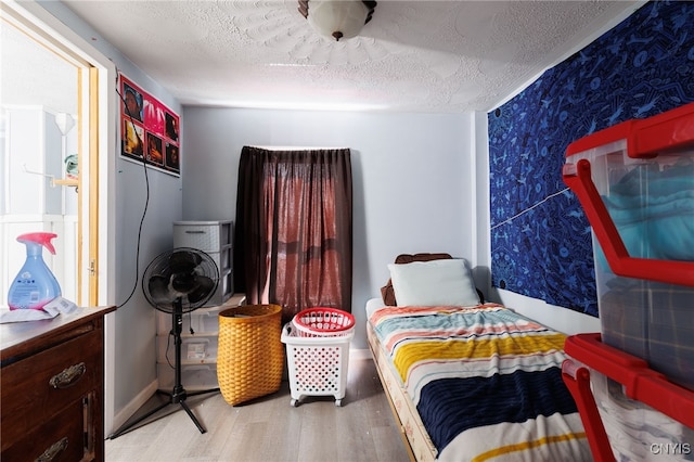 15-17A Vincent St, Champion, NY 13619 - bedroom with a textured ceiling, wallpapered walls, and wood finished floors