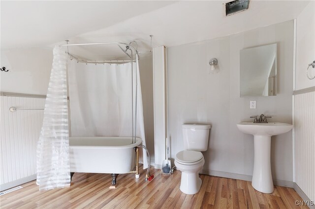 15-17A Vincent St, Champion, NY 13619 - bathroom with visible vents, a shower with shower curtain, toilet, a tub, and wood finished floors