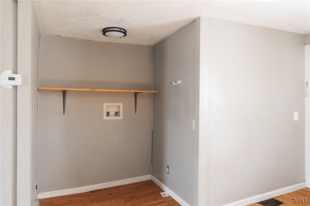 15-17A Vincent St, Champion, NY 13619 - laundry room featuring laundry area, baseboards, washer hookup, and wood finished floors