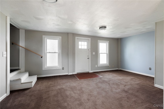 15-17A Vincent St, Champion, NY 13619 - carpeted entryway with a textured ceiling, baseboards, and stairway