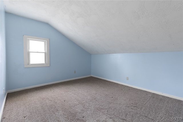 15-17A Vincent St, Champion, NY 13619 - bonus room with baseboards, carpet, a textured ceiling, and vaulted ceiling
