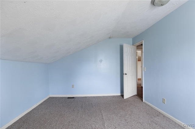 15-17A Vincent St, Champion, NY 13619 - additional living space featuring a textured ceiling, baseboards, carpet, and lofted ceiling