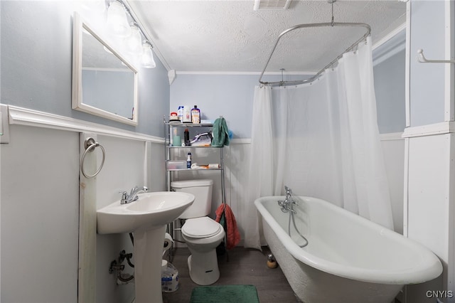 15-17A Vincent St, Champion, NY 13619 - bathroom with a shower with shower curtain, a soaking tub, a textured ceiling, toilet, and wood finished floors