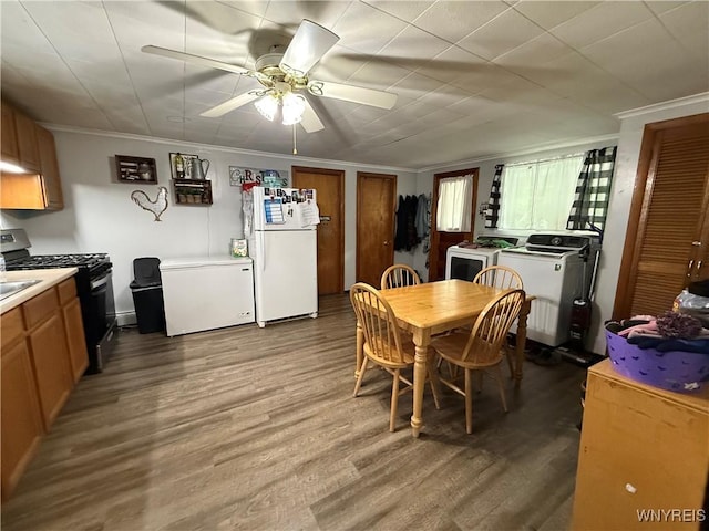 42 Mechanic St, Collins, NY 14070 - dining room with crown molding, wood finished floors, a ceiling fan, and separate washer and dryer