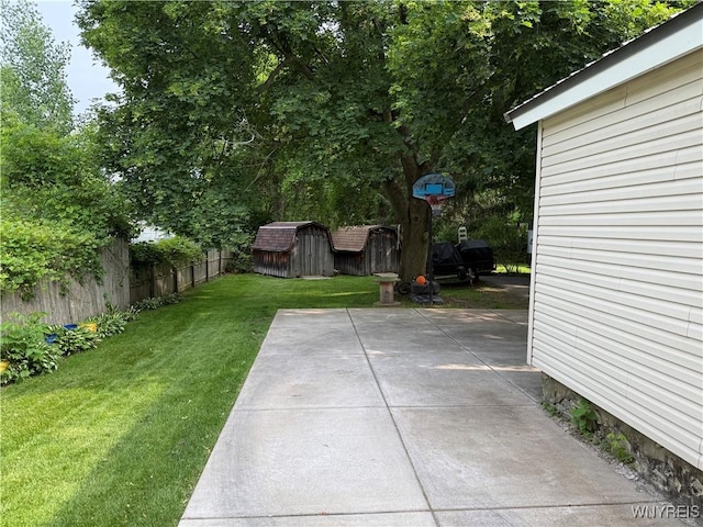 42 Mechanic St, Collins, NY 14070 - fenced backyard featuring a storage shed and a patio area