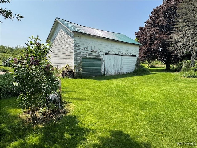 11400 Savage Rd, Sardinia, NY 14030 - view of green lawn featuring an outbuilding and a garage
