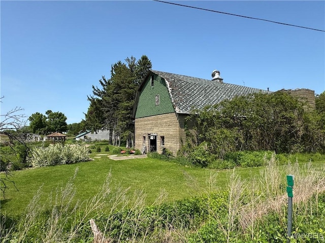 11400 Savage Rd, Sardinia, NY 14030 - view of side of property with a gambrel roof, a barn, a yard, and an outbuilding