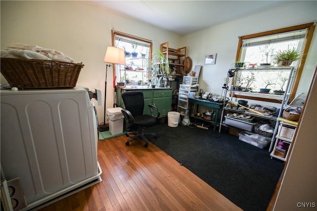 office area with a healthy amount of sunlight and hardwood / wood-style flooring