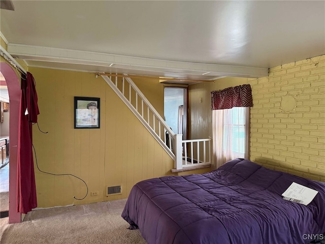 525 Bell Hill Rd, German Flatts, NY 13357 - bedroom with visible vents, carpet flooring, and brick wall