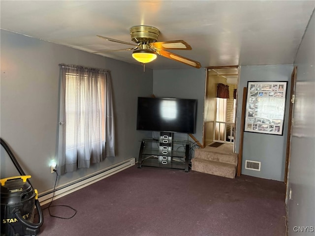 525 Bell Hill Rd, German Flatts, NY 13357 - carpeted living area featuring plenty of natural light, visible vents, a baseboard heating unit, and a ceiling fan