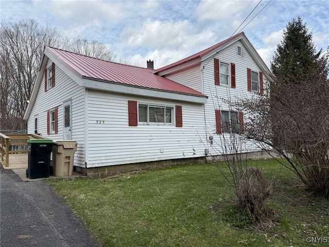 525 Bell Hill Rd, German Flatts, NY 13357 - view of front of house featuring a front yard, metal roof, and a chimney