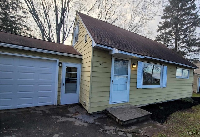 view of front of house with a shingled roof