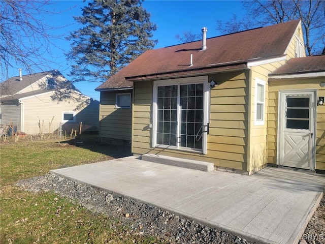 rear view of property featuring a wooden deck, fence, and a lawn