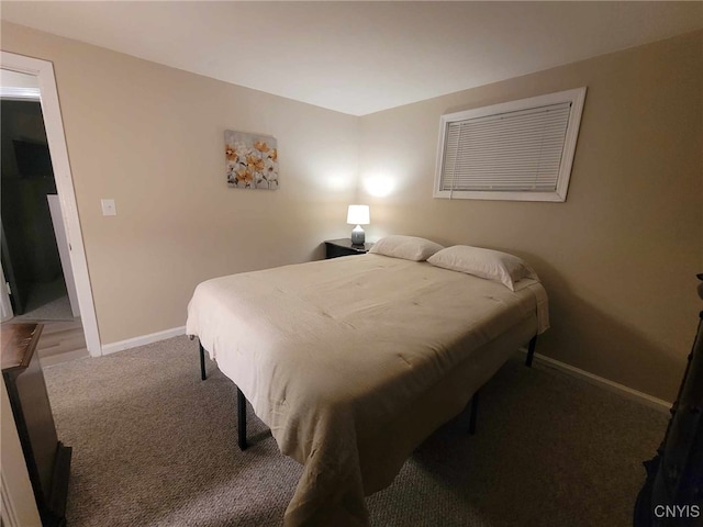 carpeted bedroom with baseboards
