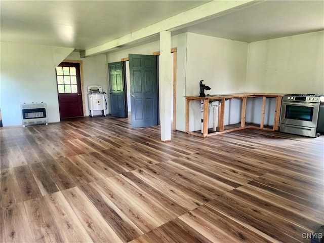 620 Albion Cross Rd, Albion, NY 13142 - unfurnished living room featuring heating unit and wood finished floors