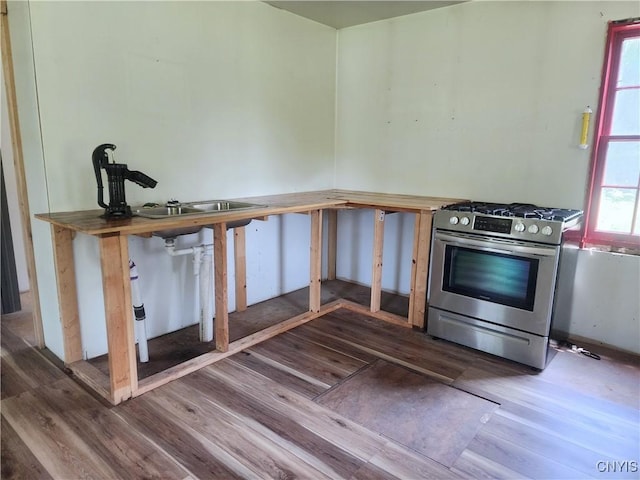 620 Albion Cross Rd, Albion, NY 13142 - kitchen featuring wood finished floors and stainless steel gas range
