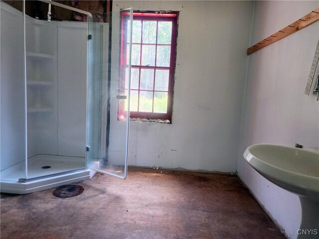 620 Albion Cross Rd, Albion, NY 13142 - full bathroom featuring a shower stall and unfinished concrete flooring