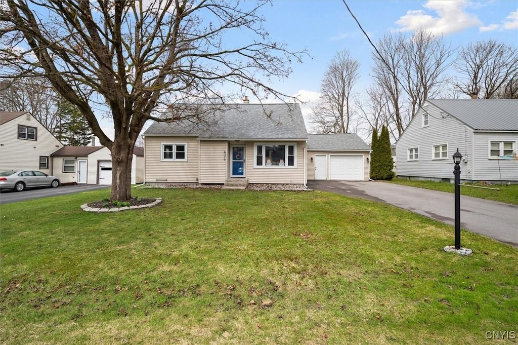 626 Pauline Ave, Deerfield, NY 13502 - view of front of house with entry steps, a garage, and a front yard