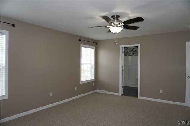 4828 Lighthouse Village Cir, Clay, NY 13088 - unfurnished room with light carpet, baseboards, a ceiling fan, and visible vents