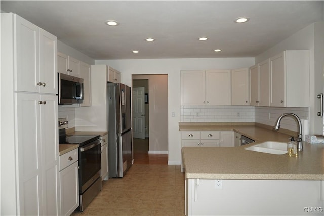 4828 Lighthouse Village Cir, Clay, NY 13088 - kitchen with a sink, light countertops, stainless steel appliances, decorative backsplash, and light tile patterned flooring