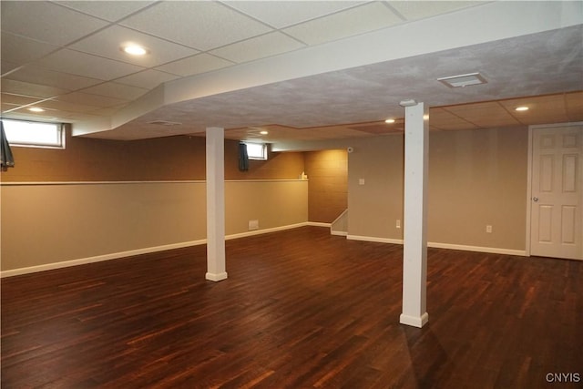4828 Lighthouse Village Cir, Clay, NY 13088 - below grade area with wood finished floors, baseboards, and a drop ceiling