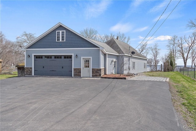 28 Wedgeworth Dr, West Monroe, NY 13167 - view of front of home featuring stone siding, asphalt driveway, and an attached garage
