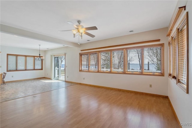 28 Wedgeworth Dr, West Monroe, NY 13167 - unfurnished living room featuring light wood finished floors, a ceiling fan, baseboards, and a chandelier