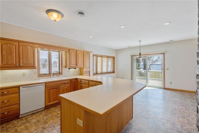 28 Wedgeworth Dr, West Monroe, NY 13167 - kitchen featuring dishwasher, a sink, light countertops, a chandelier, and a peninsula